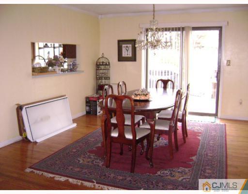 751 New Dover Road Edison, NJ 08820 - Photo 5 of 10 a view of a dining room with furniture window and wooden floor