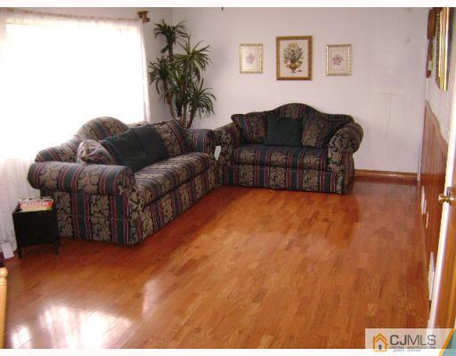 751 New Dover Road Edison, NJ 08820 - Photo 6 of 10 a living room with furniture and a couch