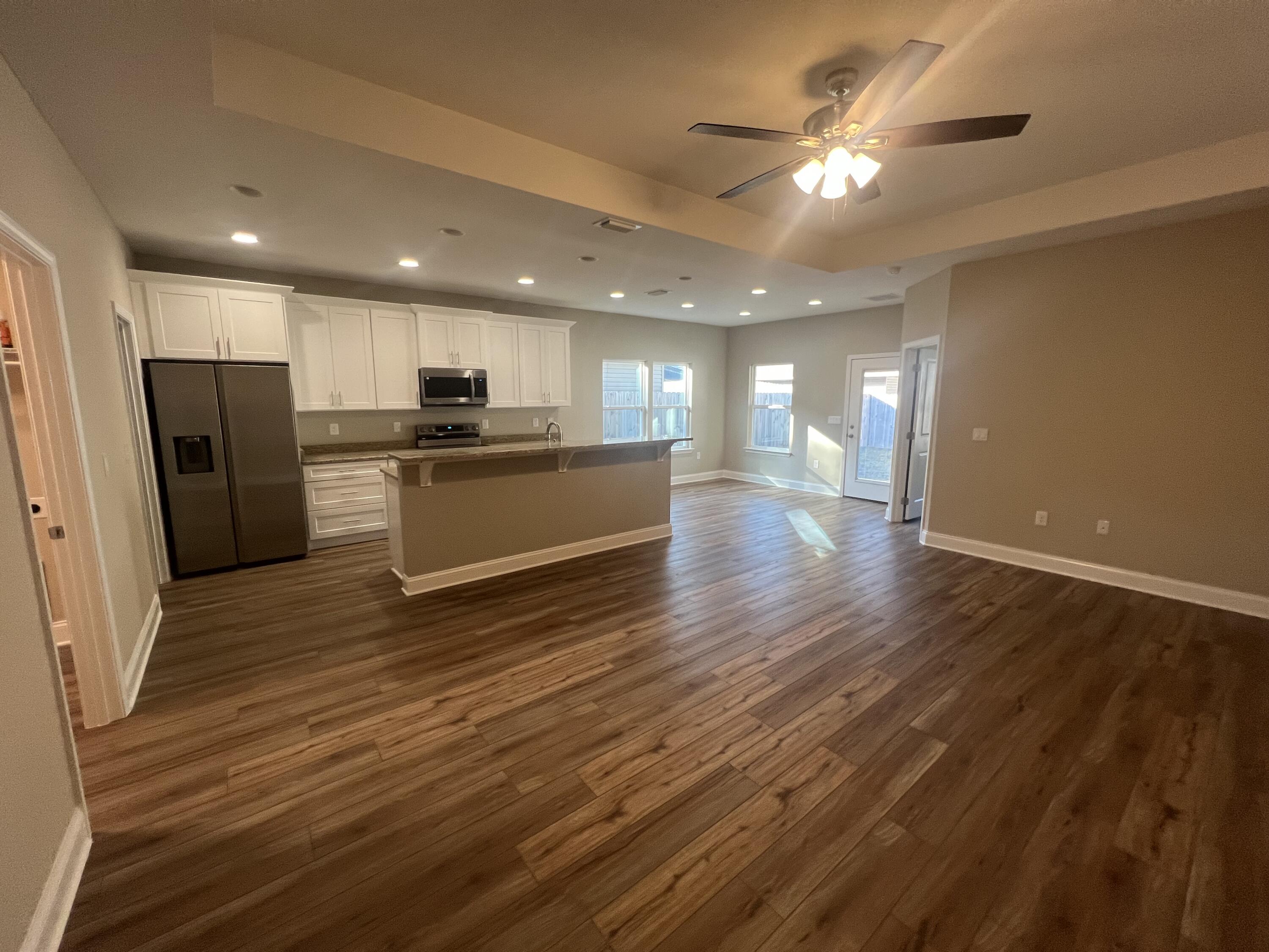 89 Hawkins Road Fort Walton Beach, FL 32547 - Photo 2 of 12 a view of a kitchen with a sink and a refrigerator