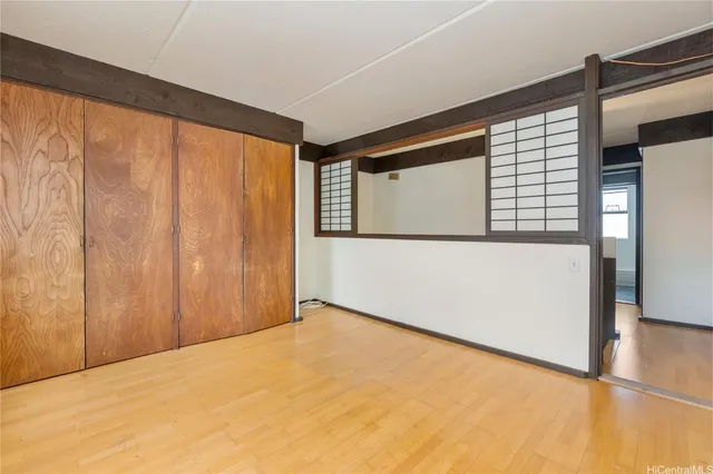 a view of an empty room with windows