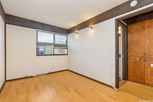 a view of an empty room with a window