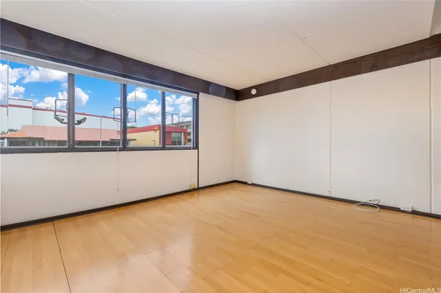 a view of an empty room with a window