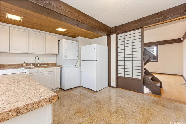 a view of a kitchen with appliances and cabinets