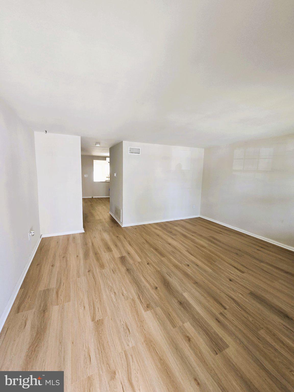 7842 St Bridget Lane Baltimore, MD 21222 - Photo 13 of 13 a view of empty room with wooden floor