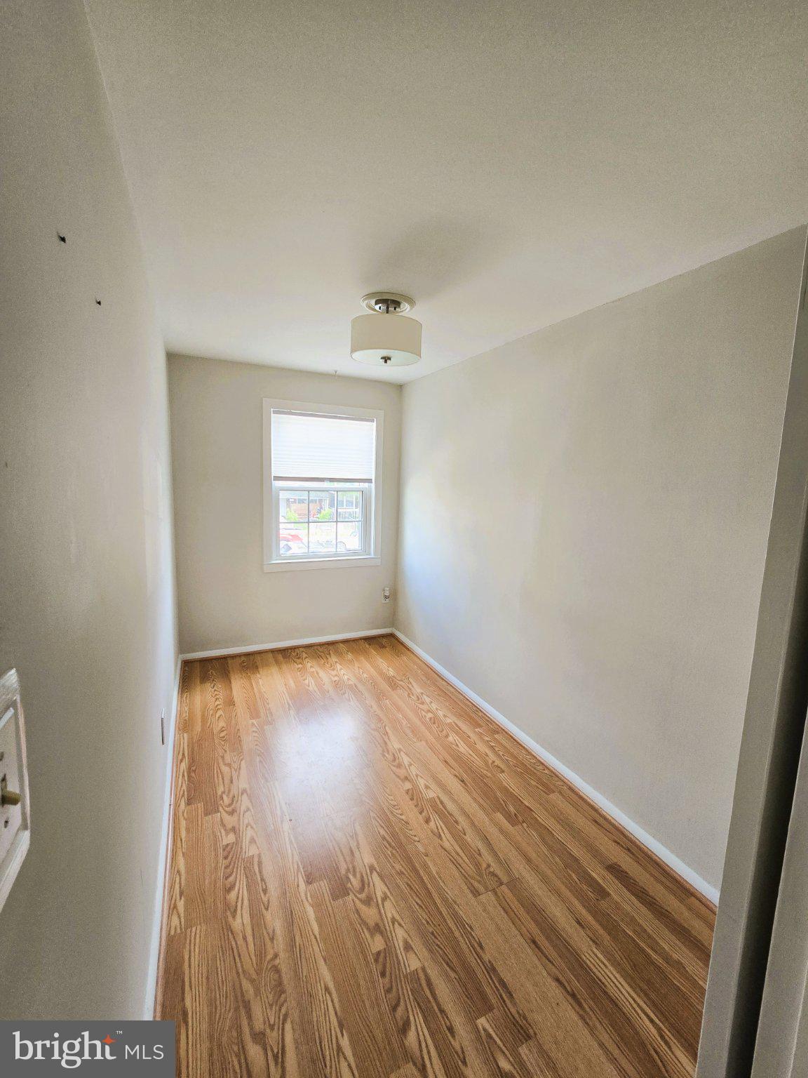 7842 St Bridget Lane Baltimore, MD 21222 - Photo 9 of 13 an empty room with a window