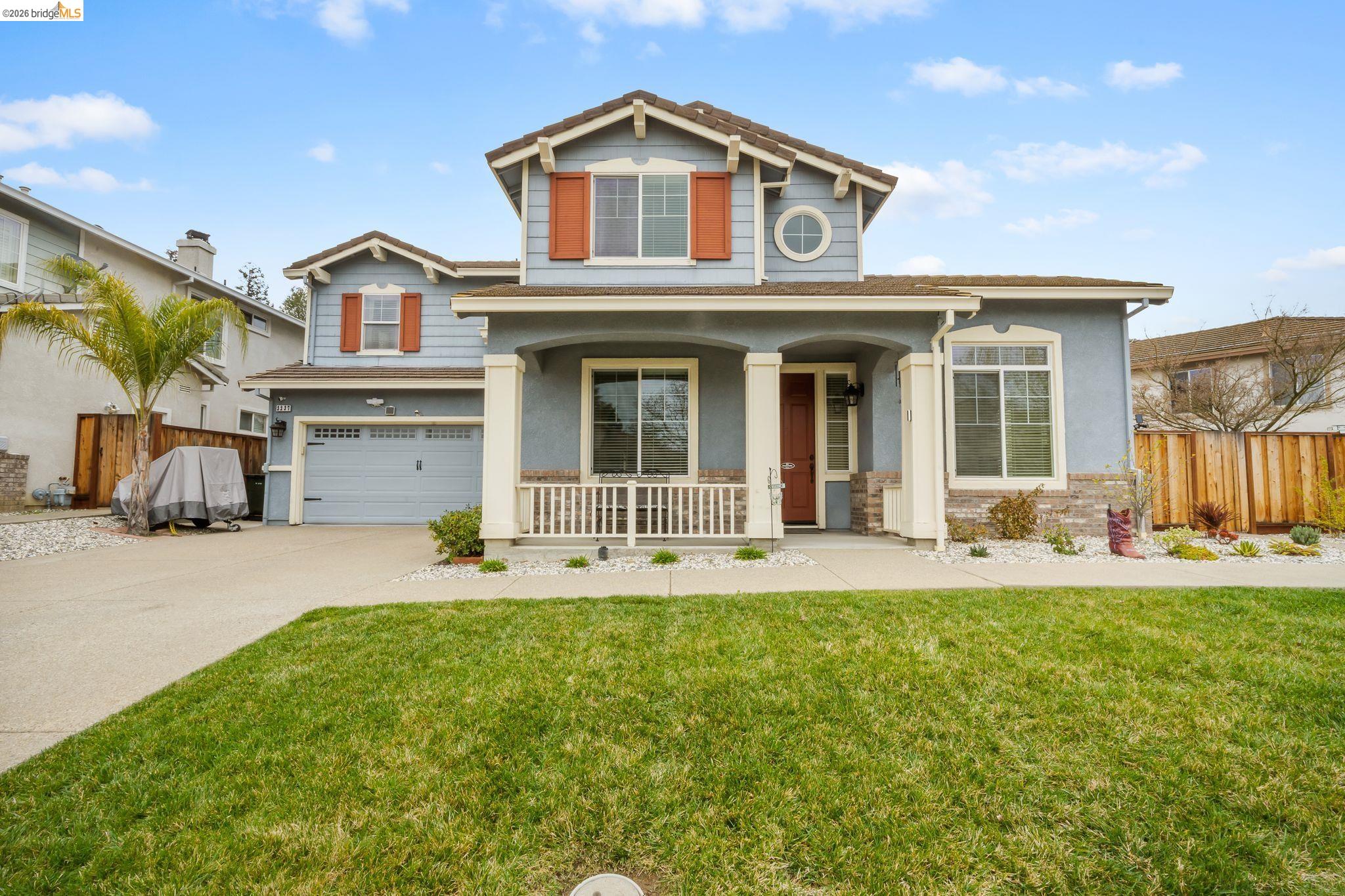 3237 Oso Grande Way Antioch, CA 94531 - Photo 1 of 47 Craftsman-style home featuring a porch, an attached garage, concrete driveway, and stucco siding