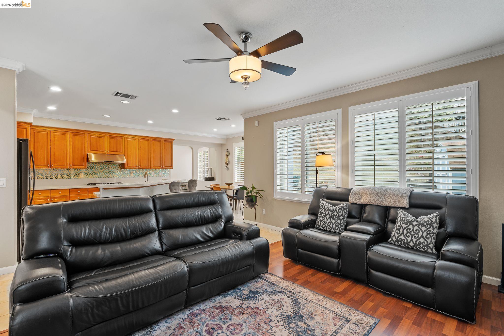 3237 Oso Grande Way Antioch, CA 94531 - Photo 11 of 47 Living area with crown molding, ceiling fan, light wood-type flooring, and recessed lighting