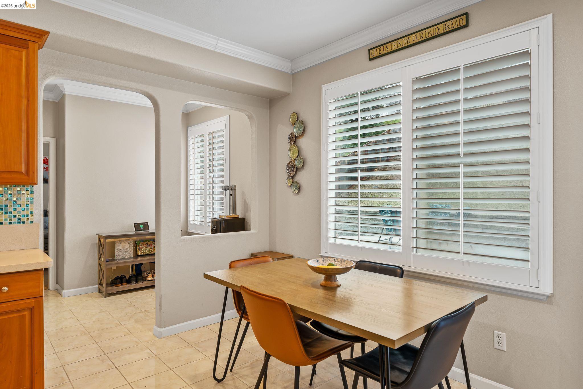 3237 Oso Grande Way Antioch, CA 94531 - Photo 16 of 47 Dining space with crown molding and light tile patterned floors