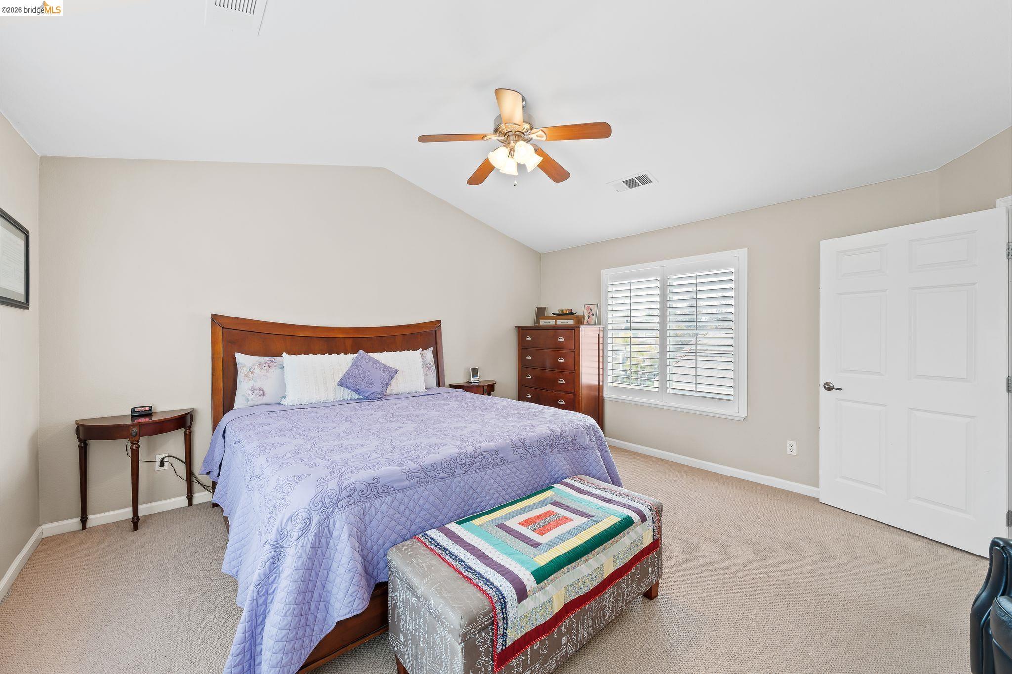 3237 Oso Grande Way Antioch, CA 94531 - Photo 24 of 47 Bedroom featuring vaulted ceiling, carpet floors, and a ceiling fan