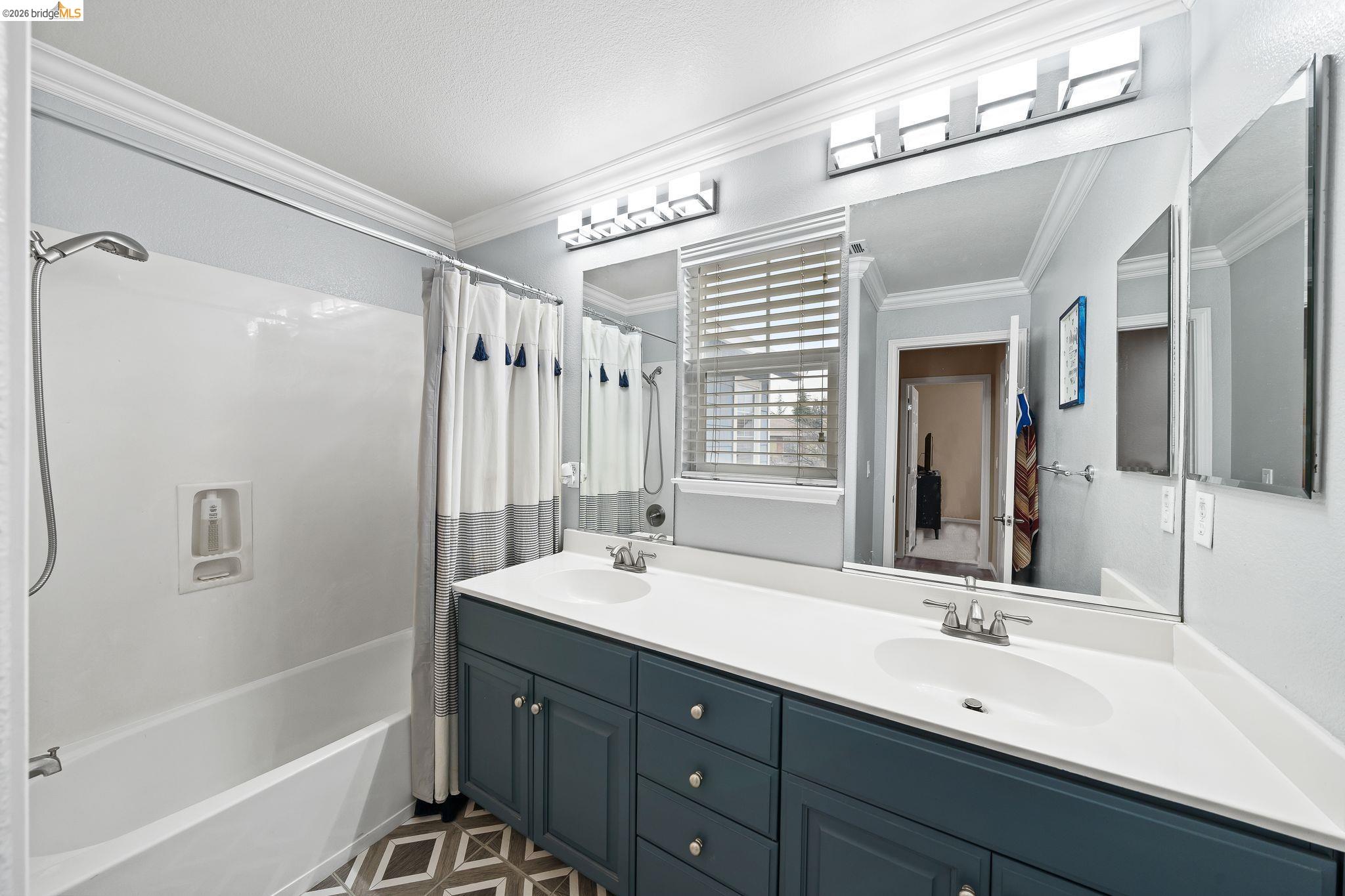 3237 Oso Grande Way Antioch, CA 94531 - Photo 32 of 47 Bathroom featuring shower / bath combo, double vanity, and ornamental molding