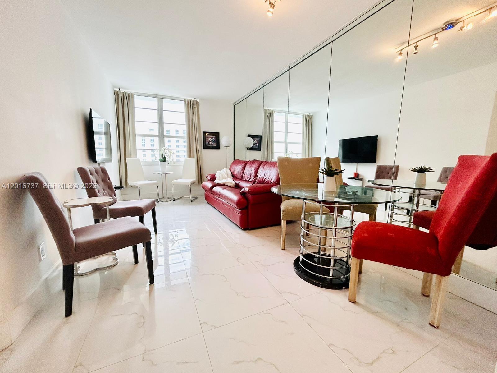 100 Lincoln Road, Unit 1526 Miami Beach, FL 33139 - Photo 1 of 9 a living room with furniture