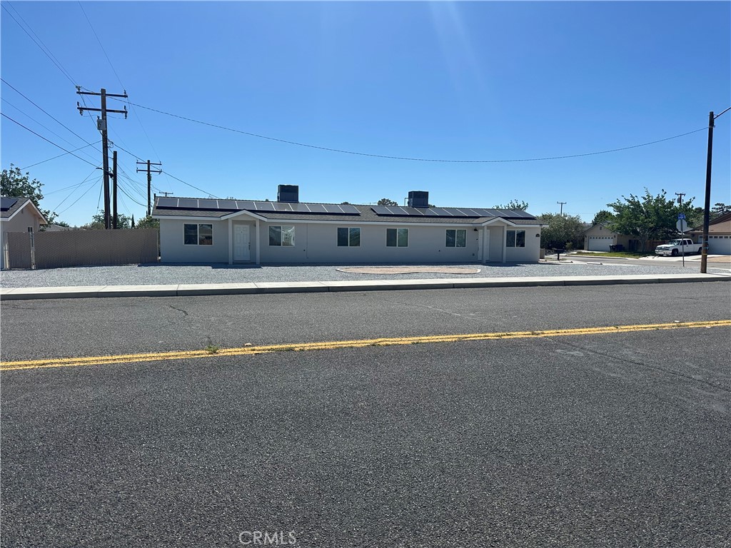 a view of swimming pool with outdoor seating and city view