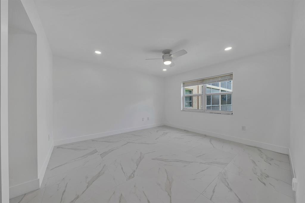 9818 Marina Boulevard, Unit 1225 Boca Raton, FL 33428 - Photo 11 of 17 an empty room with windows