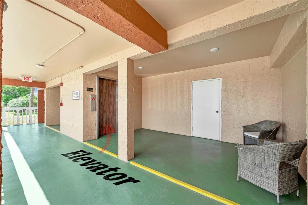 9818 Marina Boulevard, Unit 1225 Boca Raton, FL 33428 - Photo 15 of 17 a view of kitchen with furniture and staircase