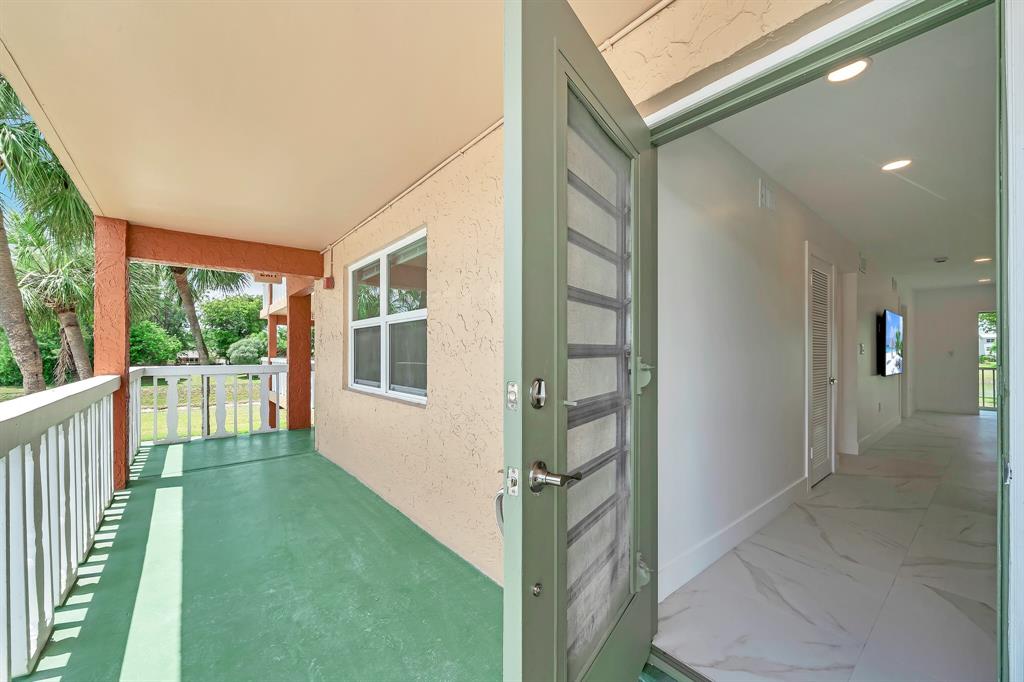 9818 Marina Boulevard, Unit 1225 Boca Raton, FL 33428 - Photo 16 of 17 a view of backyard with a garden and entryway