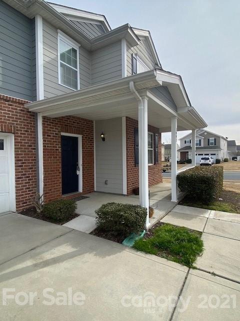 1002 Yellow Bee Road Indian Trail, NC 28079 - Photo 2 of 23 a front view of a house with a yard and garage
