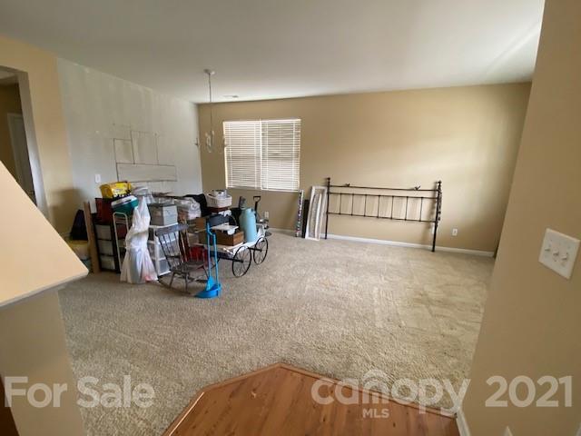 1002 Yellow Bee Road Indian Trail, NC 28079 - Photo 11 of 23 a living room with furniture and a window
