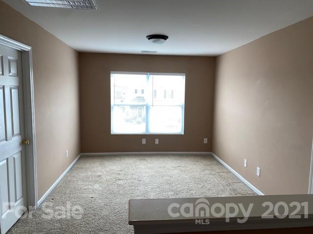1002 Yellow Bee Road Indian Trail, NC 28079 - Photo 17 of 23 an empty room with windows