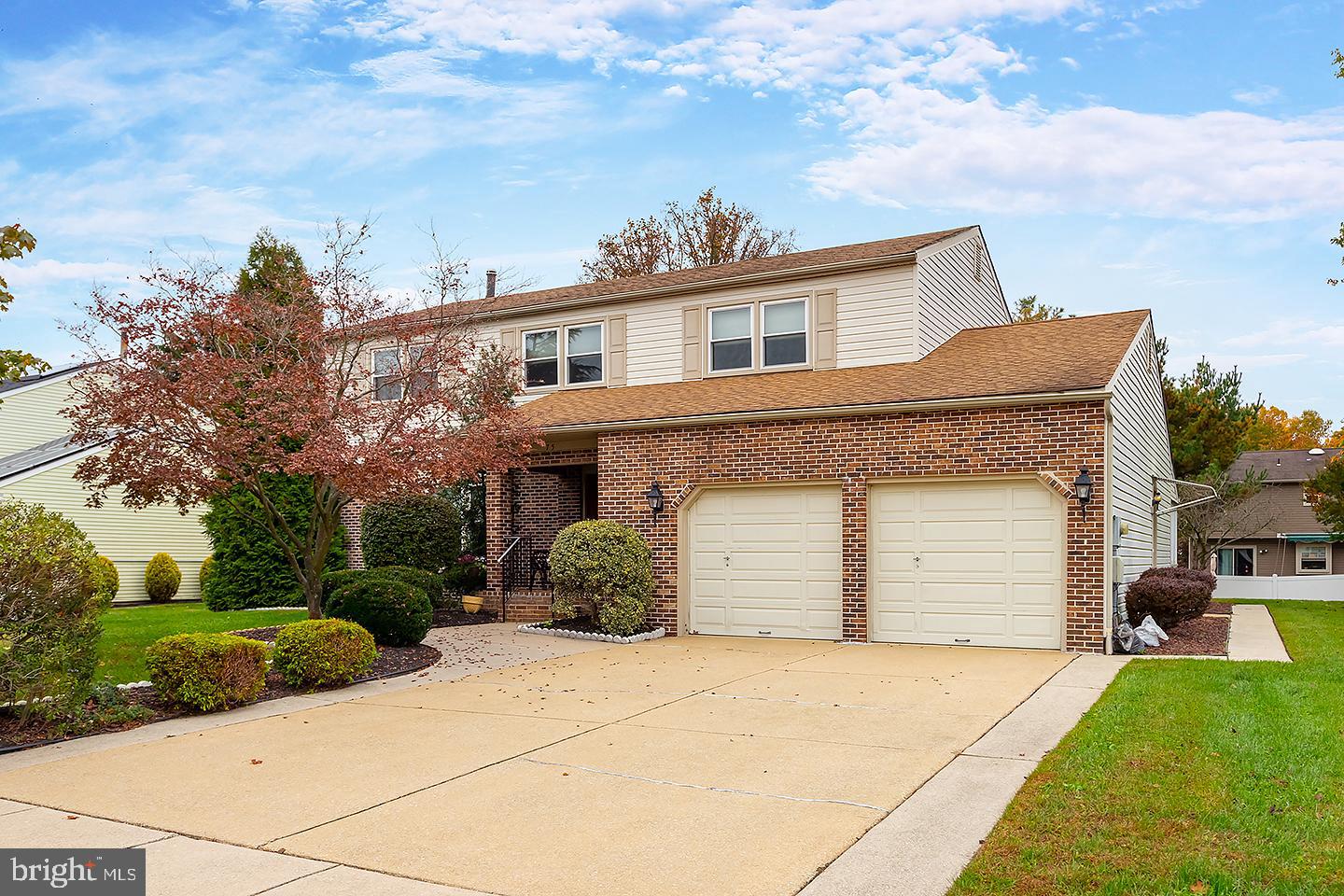75 Freedom Road Sewell, NJ 08080 - Photo 2 of 21 a front view of a house with a yard and garage