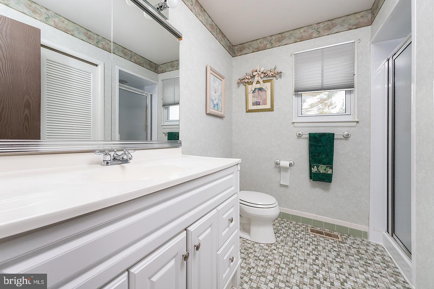 75 Freedom Road Sewell, NJ 08080 - Photo 13 of 21 a bathroom with a sink a toilet and shower