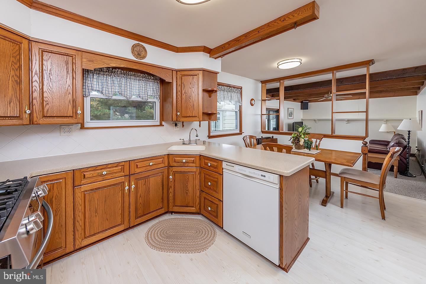 75 Freedom Road Sewell, NJ 08080 - Photo 7 of 21 a kitchen with stainless steel appliances granite countertop a stove a sink and a microwave