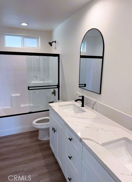 16196 Rancherias Road Apple Valley, CA 92307 - Photo 14 of 19 a bathroom with a granite countertop sink mirror vanity and toilet