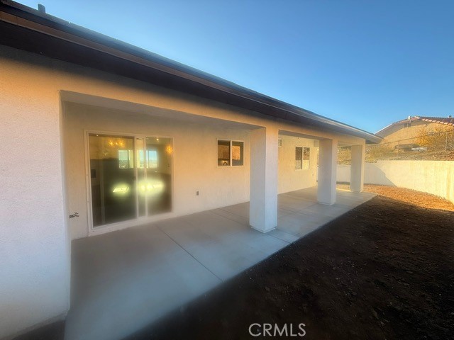 16196 Rancherias Road Apple Valley, CA 92307 - Photo 17 of 19 a view of empty room with wooden floor and fan