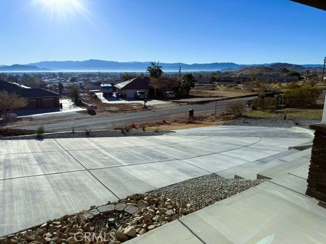 16196 Rancherias Road Apple Valley, CA 92307 - Photo 3 of 19 a view of a terrace with a yard