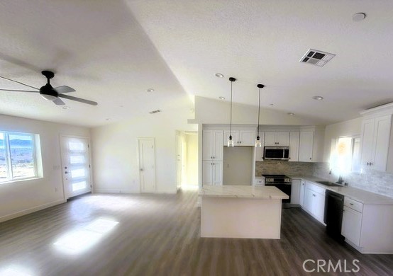 16196 Rancherias Road Apple Valley, CA 92307 - Photo 5 of 19 a view of kitchen with stainless steel appliances refrigerator oven stove and wooden floor