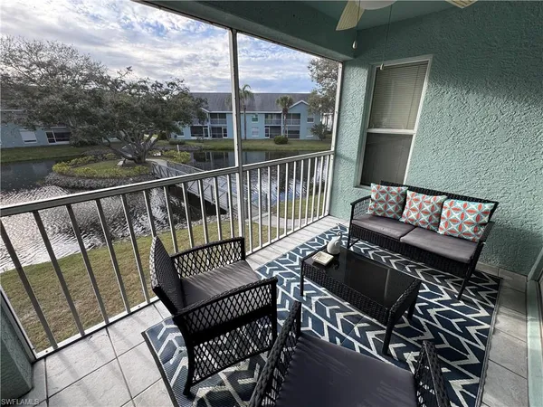 a view of a balcony with chairs