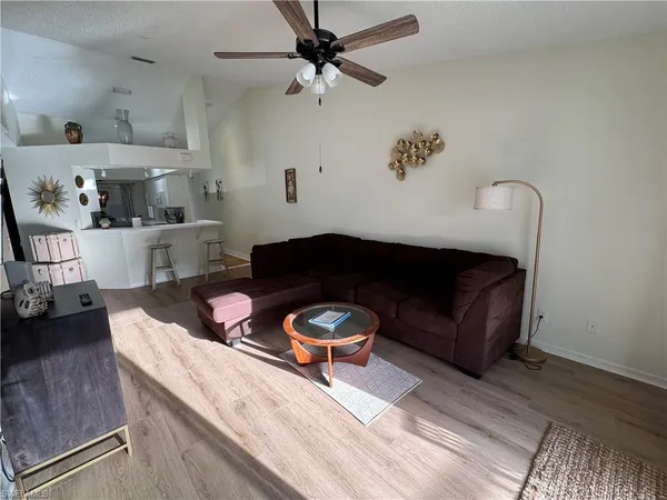a living room with furniture and a rug