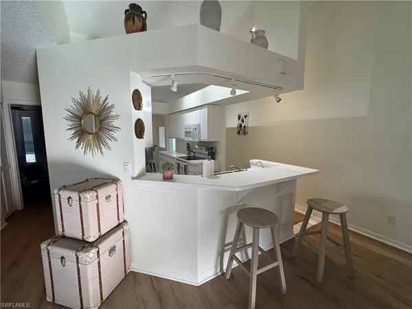 a kitchen with a table and chairs