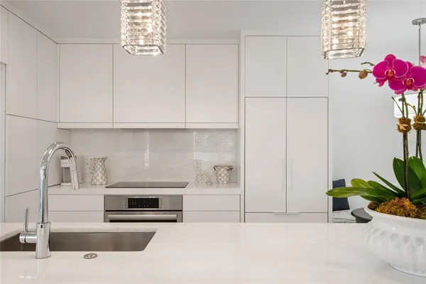 a kitchen with a stove and cabinets