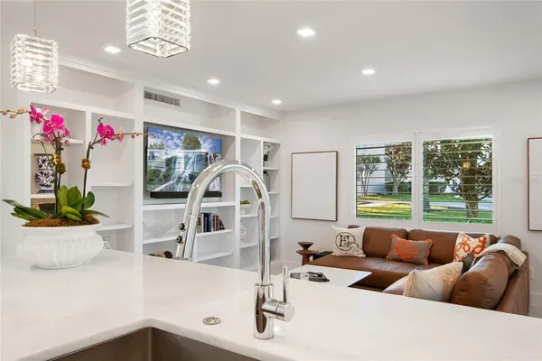 a spacious bedroom with a bed and a view of bathroom