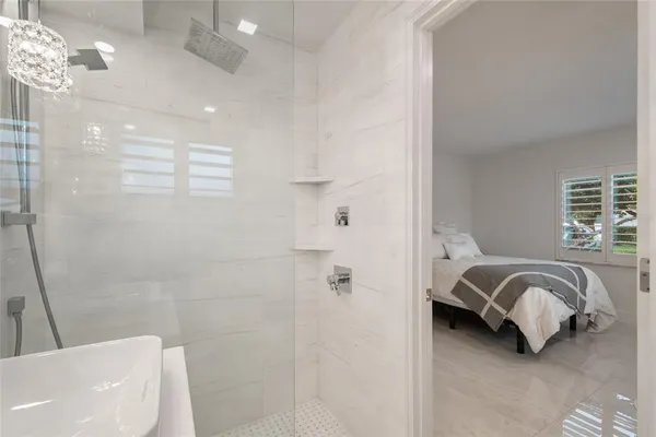 a bathroom with a sink and a washer dryer