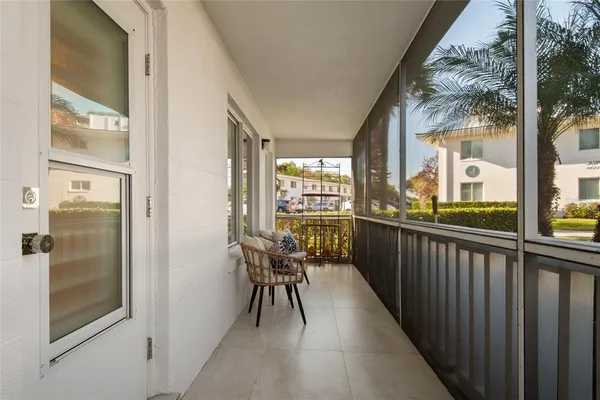 a view of balcony with furniture
