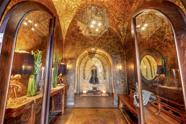 a living room with fireplace furniture and a wooden floor