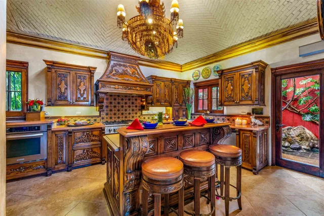 a bedroom with furniture and a chandelier