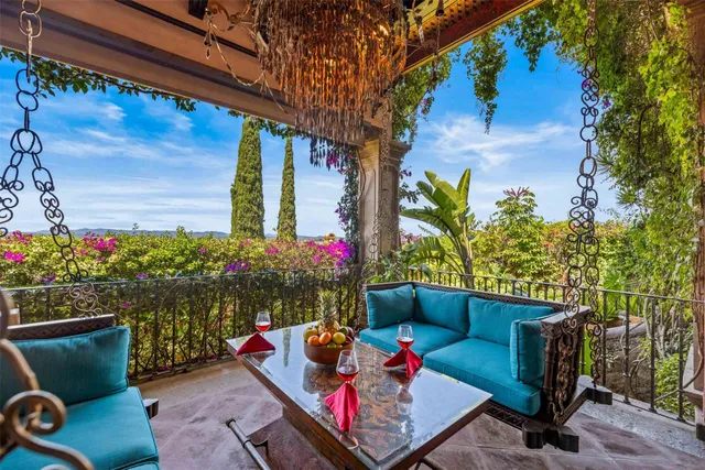 a outdoor living space with furniture and flowers