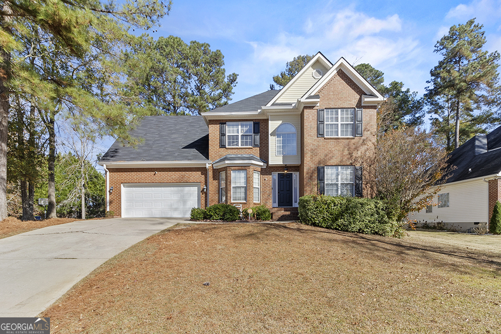643 Millrun Court Macon, GA 31210 - Photo 13 of 45 a front view of a house with a yard