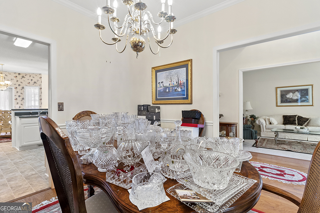 643 Millrun Court Macon, GA 31210 - Photo 21 of 45 a living room with dining table and chairs