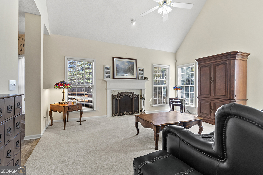643 Millrun Court Macon, GA 31210 - Photo 29 of 45 a living room with furniture and a fireplace
