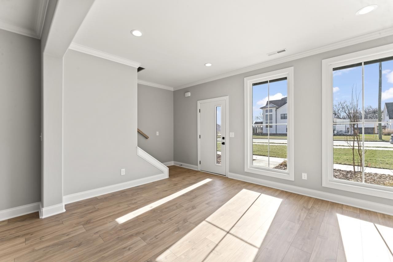 1365 Rebecca Johns Drive Murfreesboro, TN 37128 - Photo 11 of 31 a view of empty room with wooden floor and fan