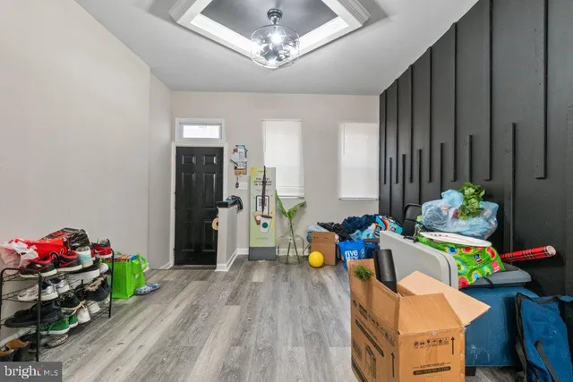 a bed room with furniture and a wooden floor