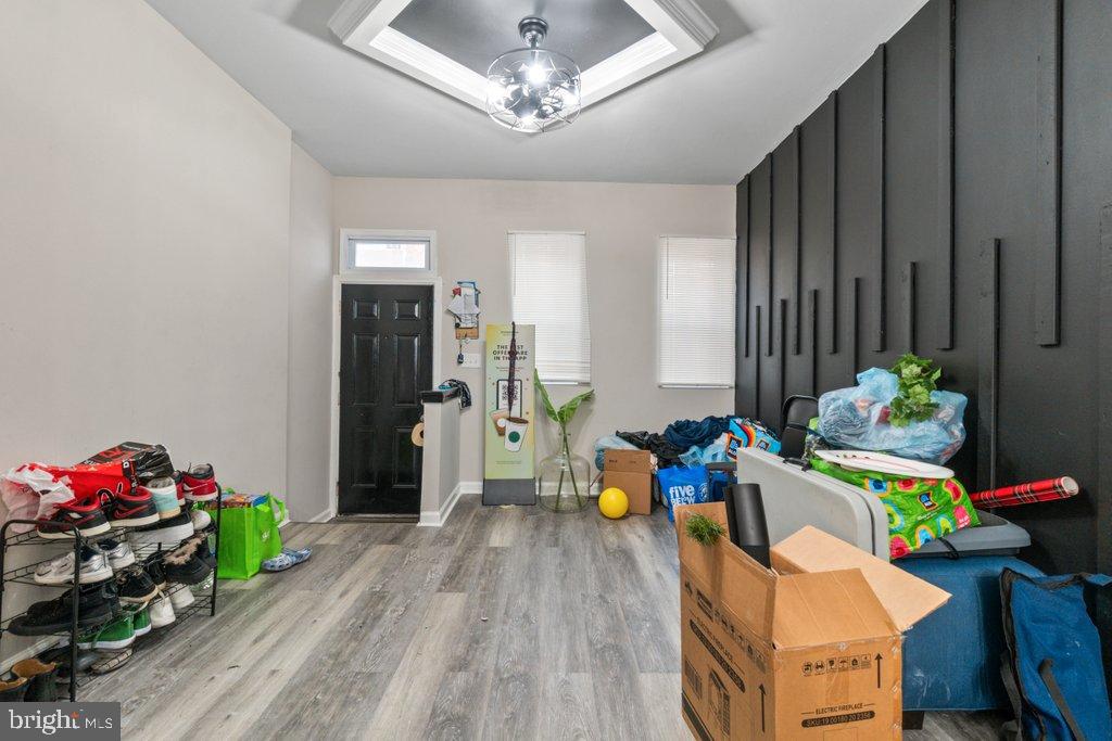 701 Baker Street Baltimore, MD 21217 - Photo 6 of 26 a bed room with furniture and a wooden floor