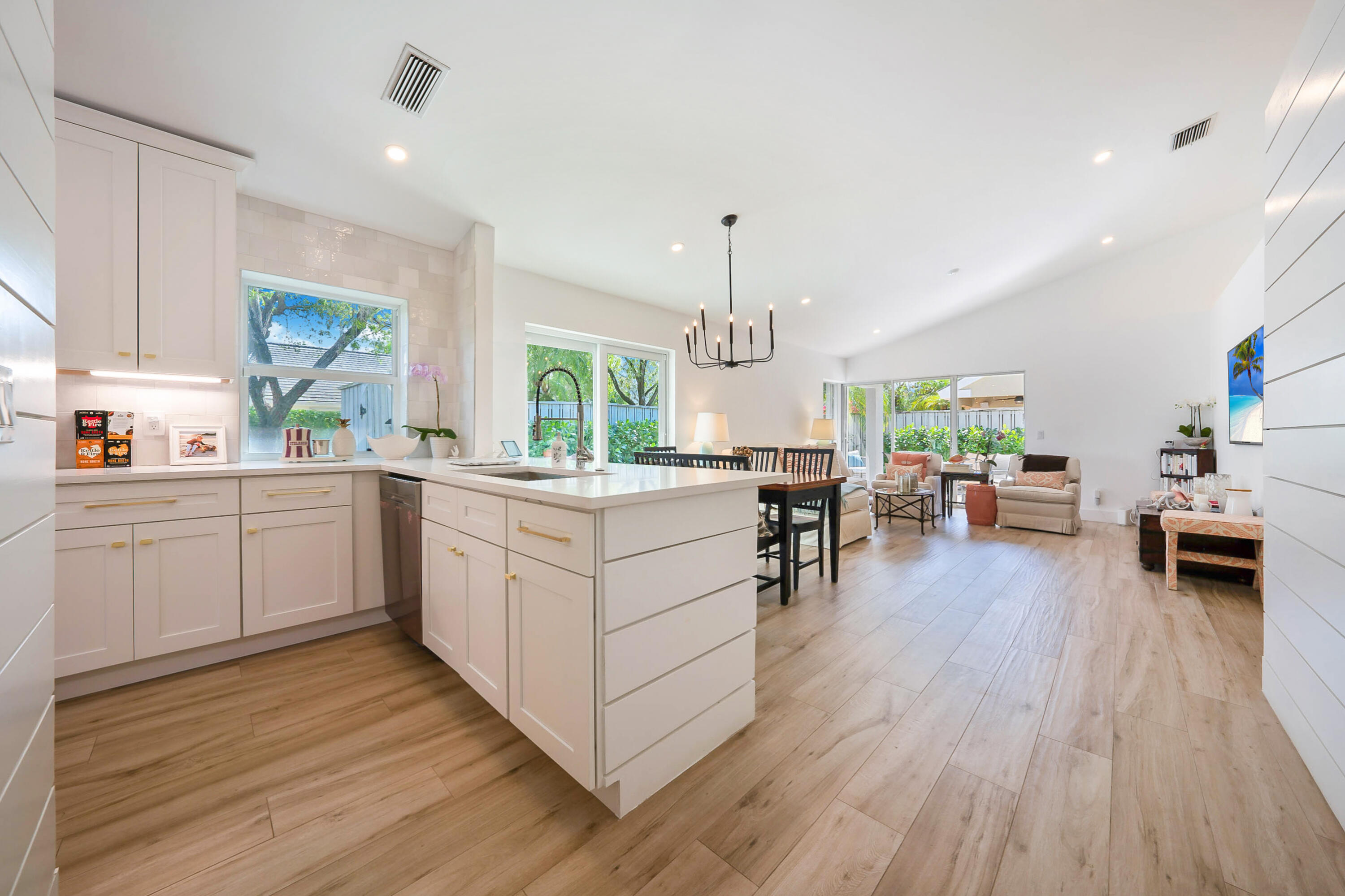 a kitchen with a lot of counter top space and a wooden floor