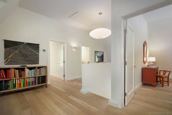 a view of room with furniture and wooden floor