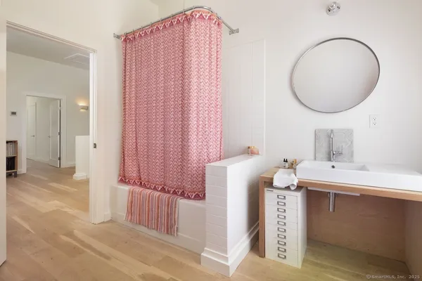 a bathroom with a sink and a mirror
