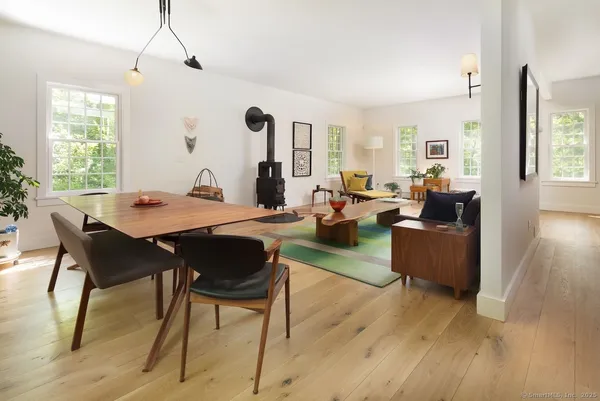 a view of a dining room with furniture window and wooden floor