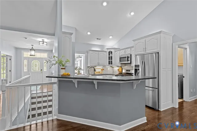a kitchen with counter top space and stainless steel appliances